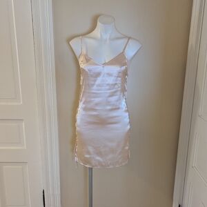 Pale pink satin mini slip dress with lace up sides size S